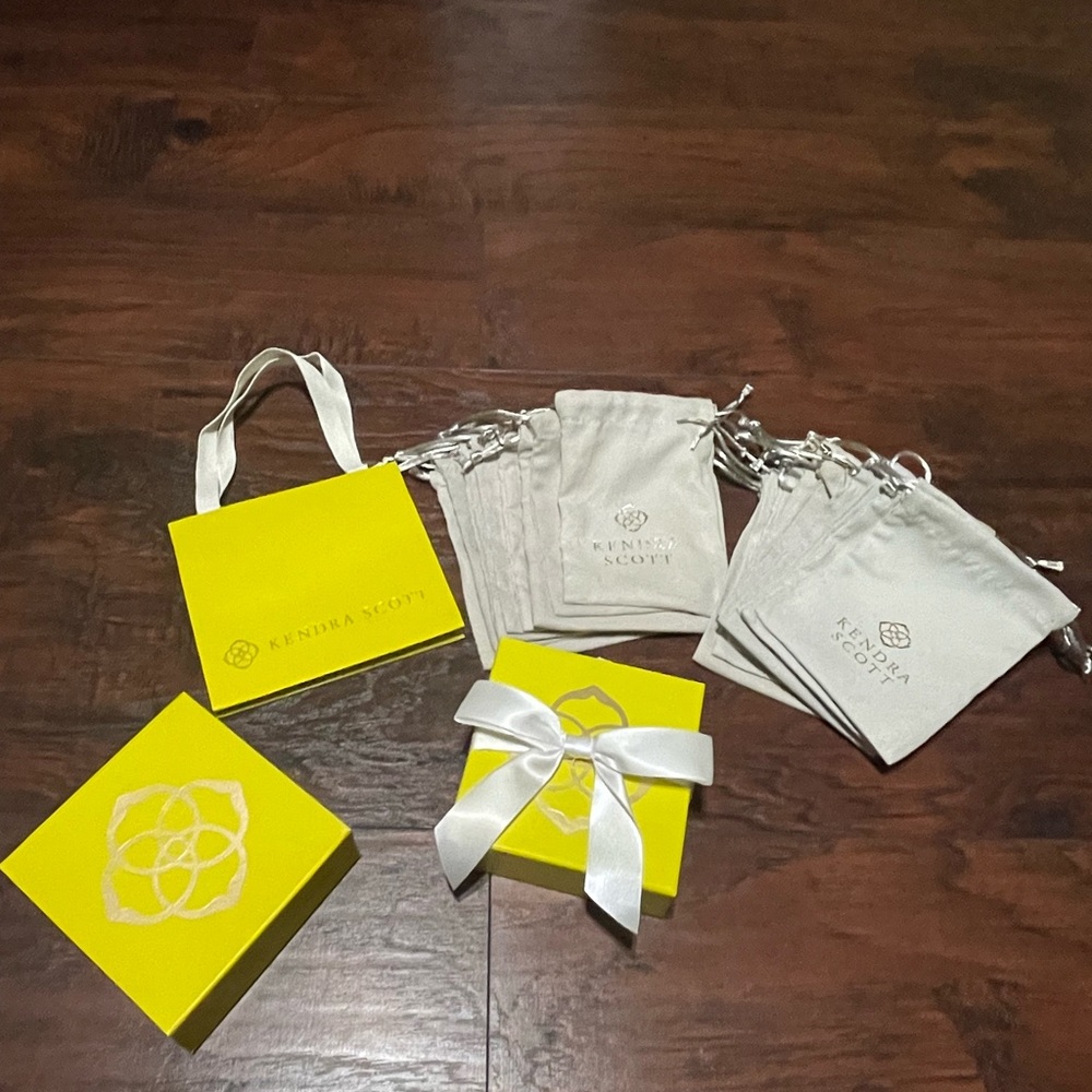 Kendra Scott Yellow Gift 2 boxes , 19 grays Pouches and 1 gift yellow bag